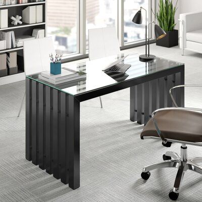 glass-top desk with black legs in modern workspace by Vlite Furnitech