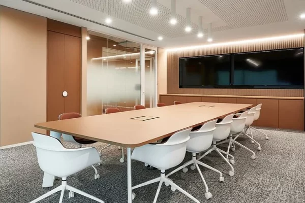 Grey color flooring conference room with light brown desk