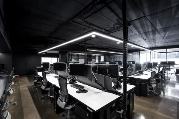 Grey color office with white desk