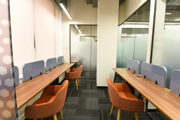 YesssWork office desk with orange chairs