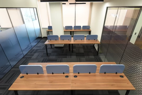 YesssWork workstations in glass partition cabin